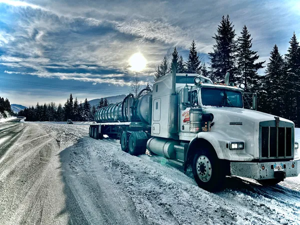 A royal flush septic truck parked on an icy Mat-Su Valley road.